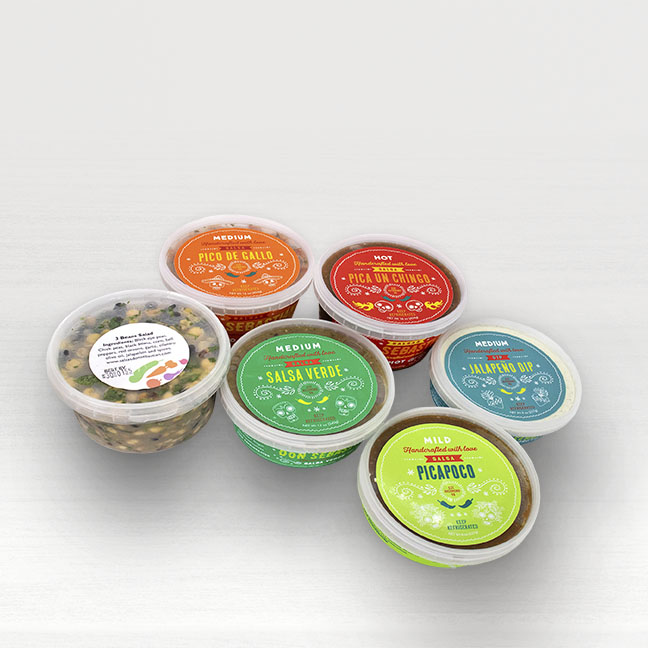 A collection of packaged salsas against a white background